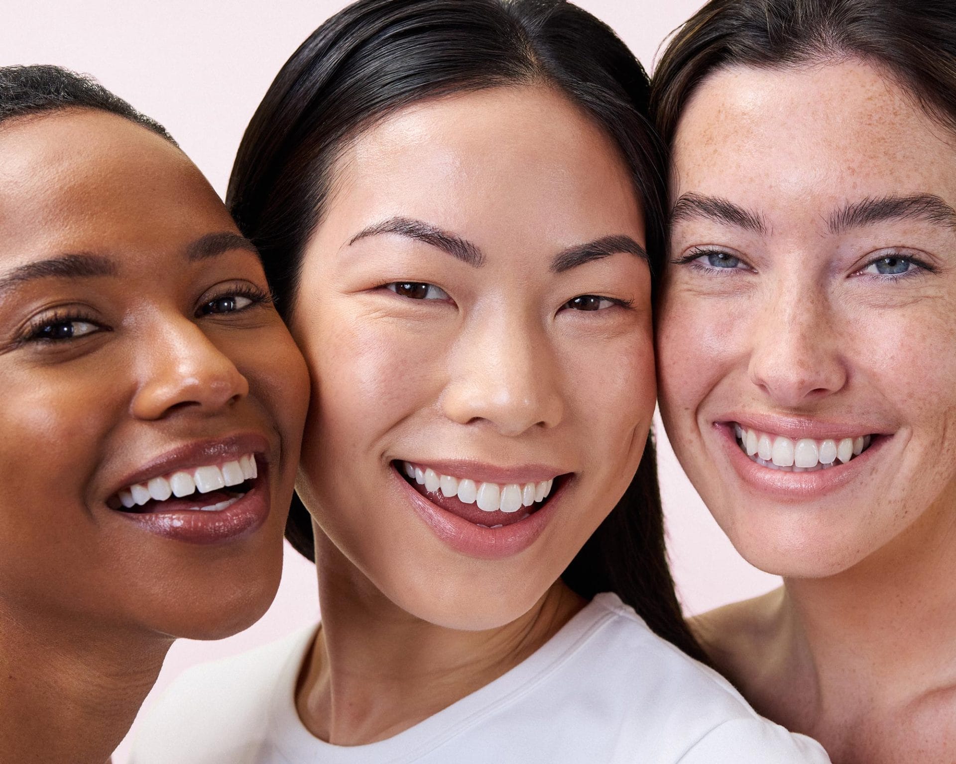 Three women with their faces close together who use Dear Brightly's Night Shift